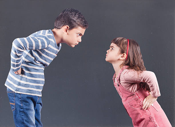 Kids having an argument Brother and sister having an argument. Family relationships concept rivalry stock pictures, royalty-free photos & images