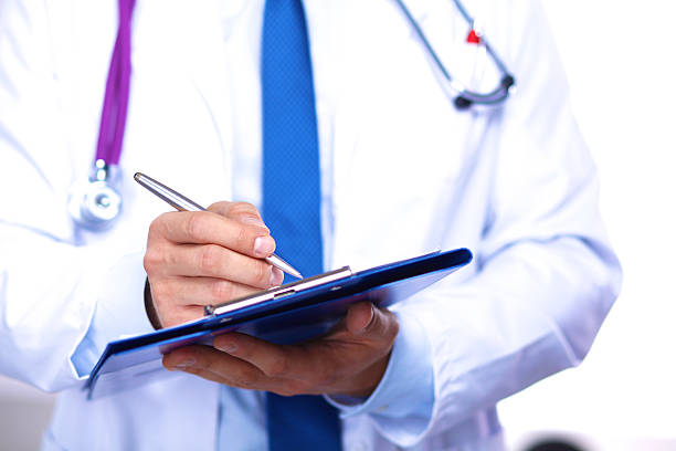 istock young doctor in the Office makes an entry 623215204