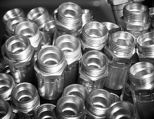Metal hydraulic fittings stands on the silver table