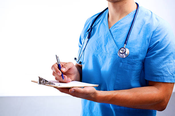 istock young doctor in the Office makes an entry 623265000