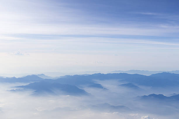 istock Blue sky and mountains view from airplane stylized hipster background 623266842