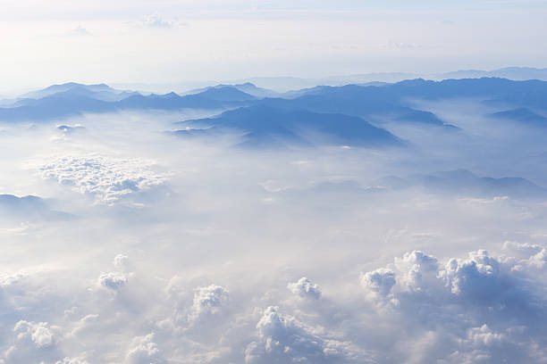 istock Blue sky and mountains view from airplane stylized hipster background 623266950