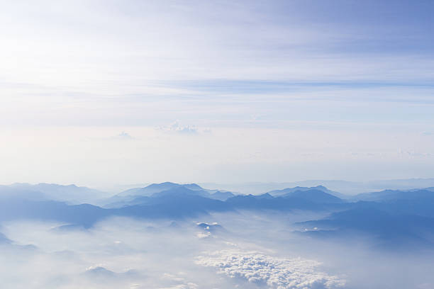 istock Blue sky and mountains view from airplane stylized hipster background 623267042