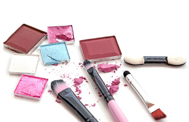 istock make-up brushes in holder and cosmetics isolated on white 623270350