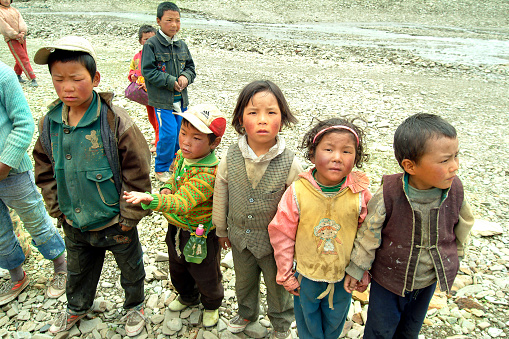 Tingri, China - July 9, 2004: Group of unidentified children in the rural area of Tingri in Tibet