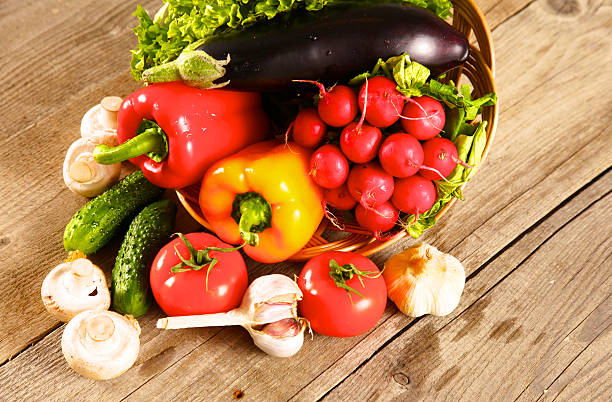 istock Fresh vegetables on a clean wooden table 623271386