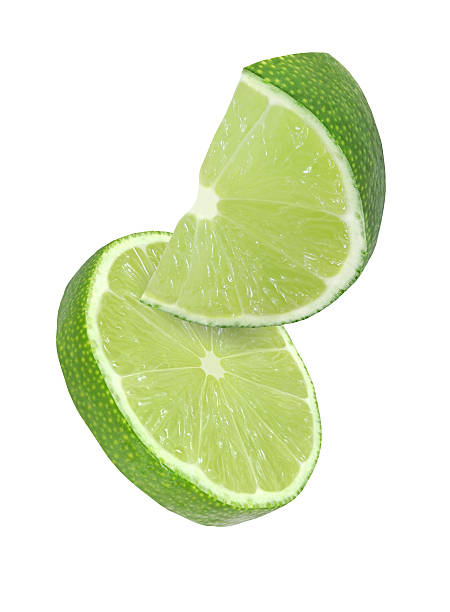 hanging, falling, flying lime fruits isolated with clipping path