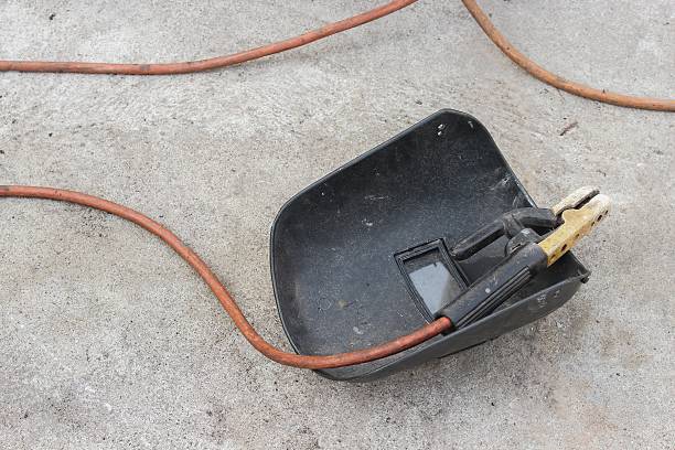 istock welding mask, still life of rod-holder with cable and electrode 623275400