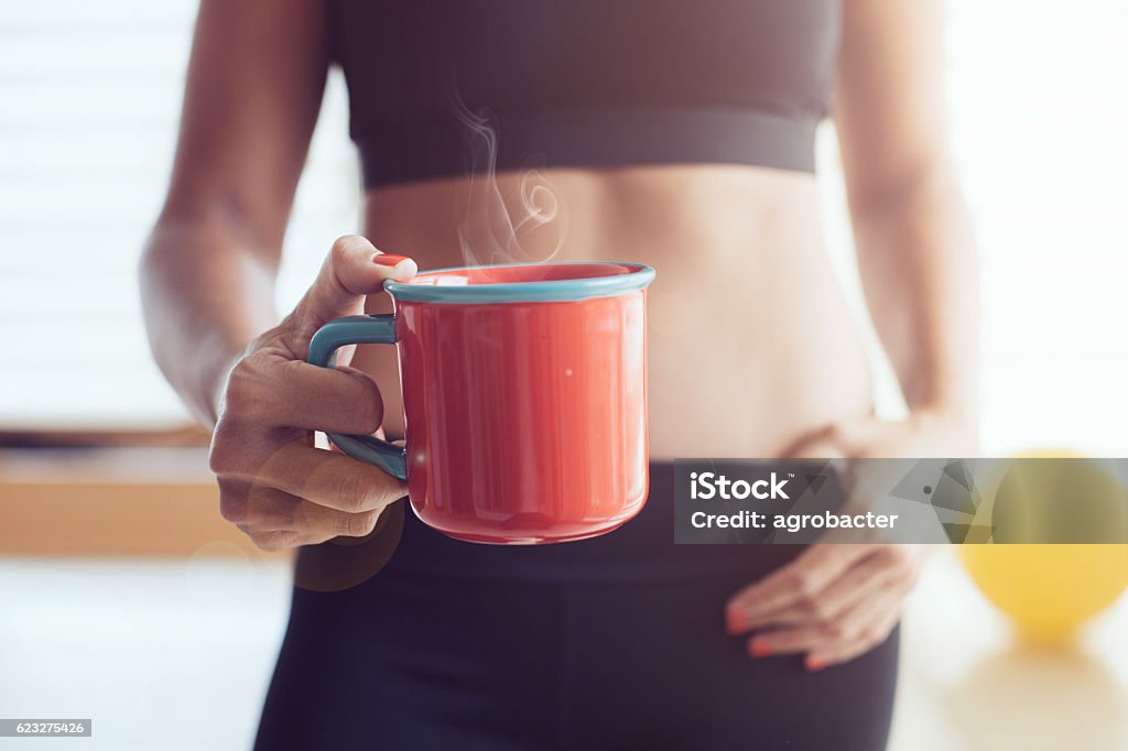 Athletic young woman with cup Coffee - Drink Stock Photo