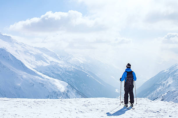skiing background, skier in beautiful mountain landscape