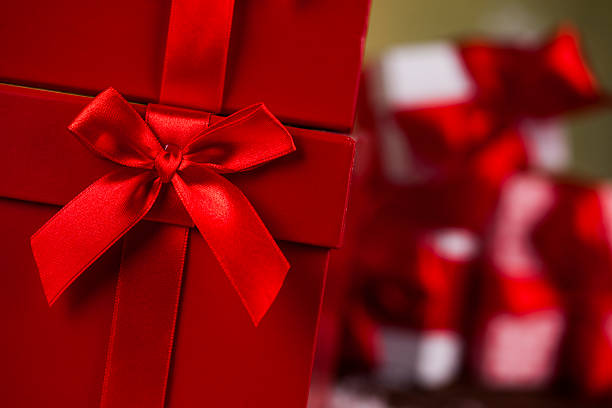 istock Beautiful gift box with red ribbon on Christmas background 623275990