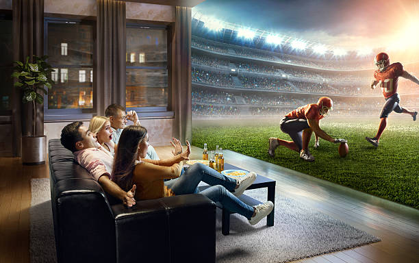istock Students watching very realistic American football game at home 623278496