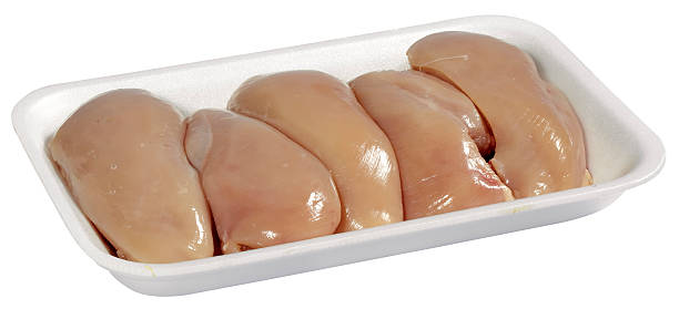 istock raw chicken meat in plastic tray isolated on white background 623279592