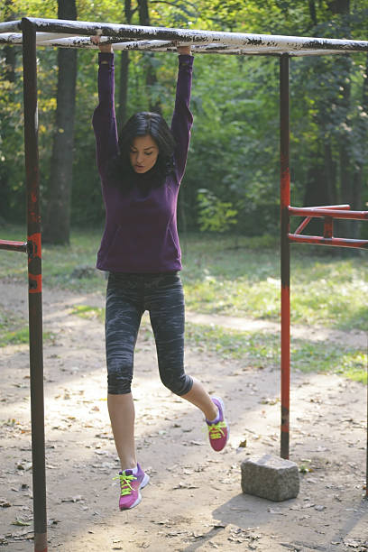 istock Fitness woman on metal bars 623283432