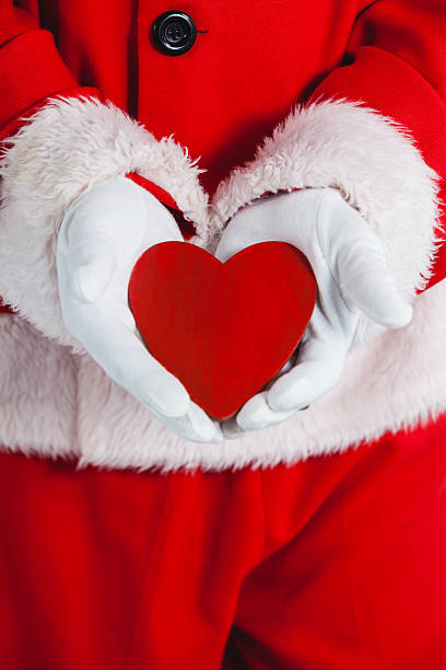 istock Mid section of santa claus showing red heart shape 623283872