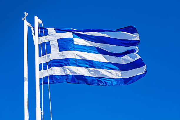 istock Greek Flag Against Blue Sky 623284128