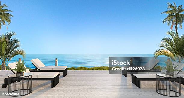 3d Rendering Outdoor Beach Bed Near Beach With Beautiful Sky Stock Photo - Download Image Now