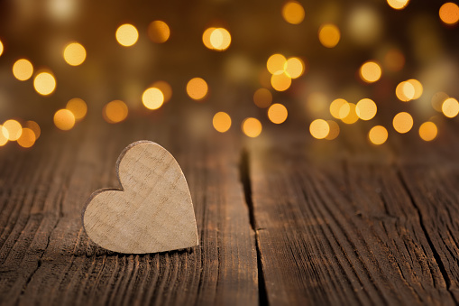 Wooden heart with Bokeh background and copyspace