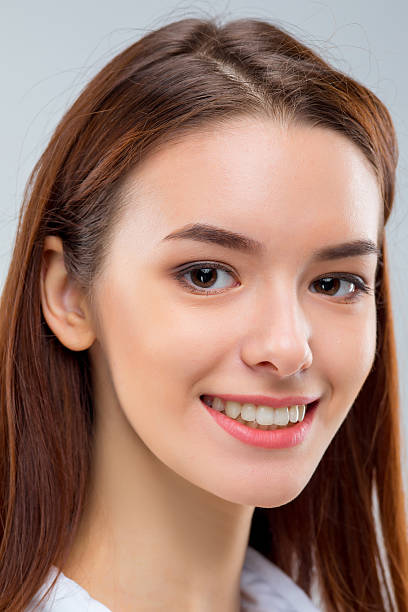 istock The happy woman on gray background 623285388