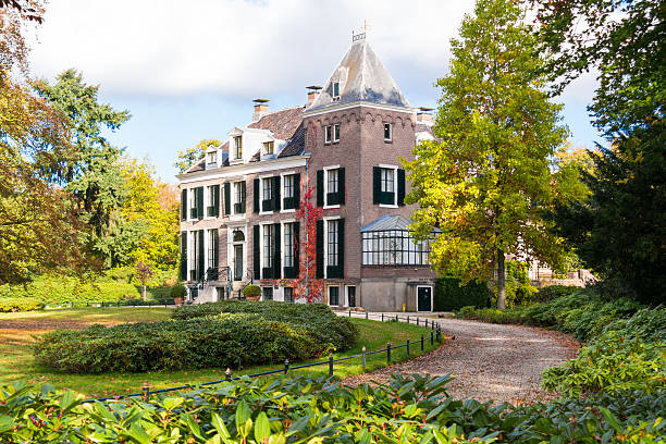 's Graveland, Netherlands - October 29, 2016: Front of manor estate Boekesteyn with driveway in autumn, 's Graveland, Netherlands