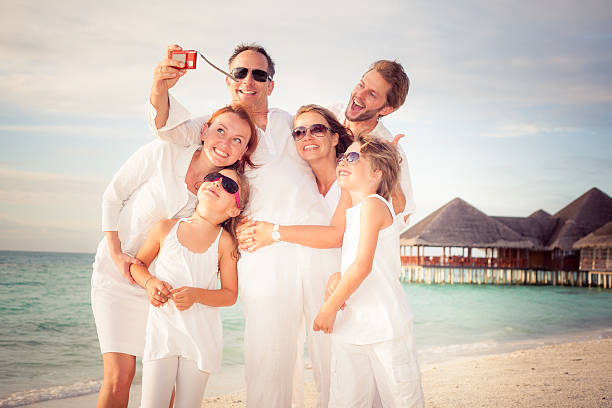 istock happy family selfie beach holiday 623287796
