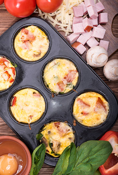 istock Delicious egg muffins with ham, cheese and vegetables. 623290230