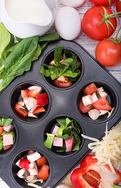 istock Delicious egg muffins with ham, cheese and vegetables. 623290972