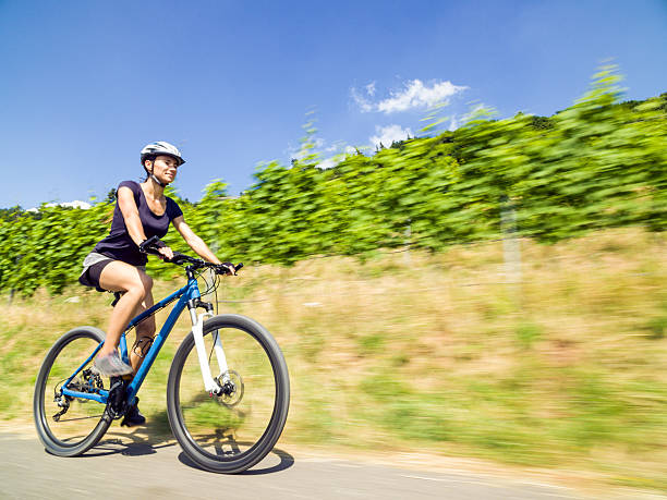 Young woman riding her mountain bike