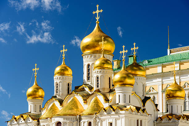 istock The orthodox cathdral with its golden domes inside the Kremlin 623291136