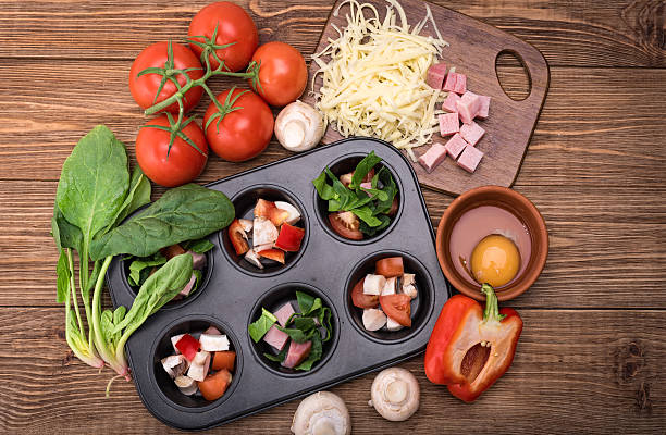 istock Delicious egg muffins with ham, cheese and vegetables. 623291354