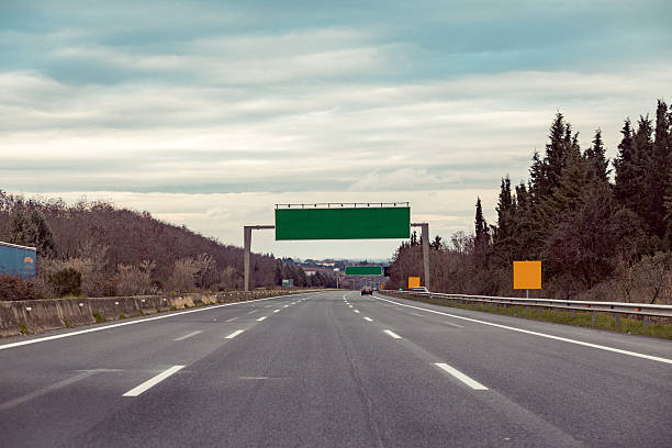 Blank road destination sign on motorway