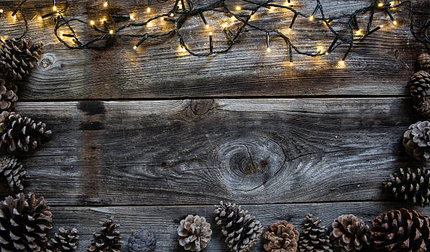 istock Christmas light with fir cones for natural frame, copy space 623291570