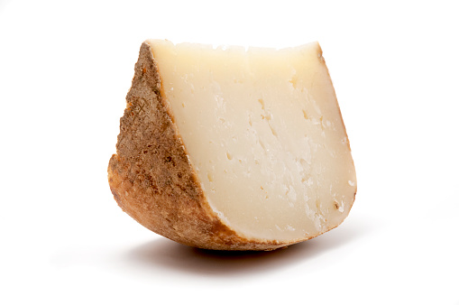 Marzolino cheese on a white background