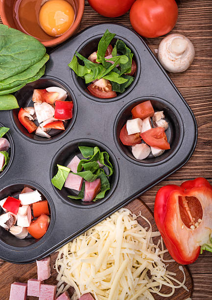 istock Delicious egg muffins with ham, cheese and vegetables. 623291804