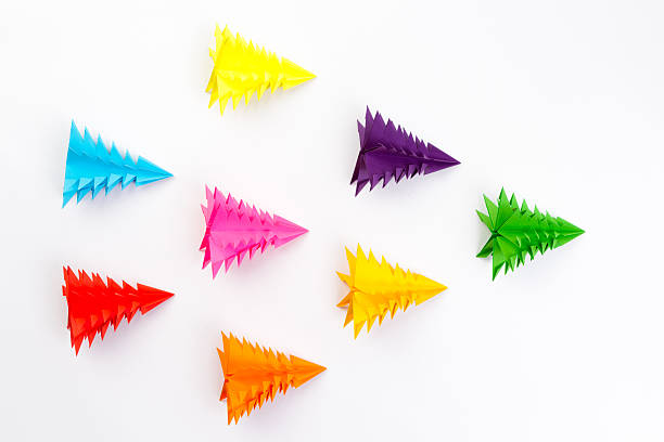 istock Christmas tree made of paper an arrow, white background 623292968
