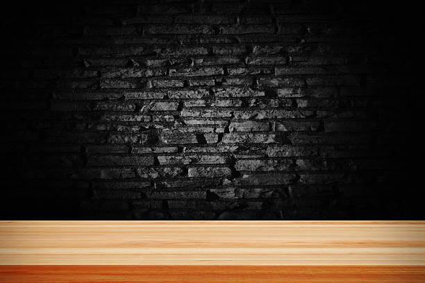 istock Abstract black grunge brick and wooden table deck. 623293004