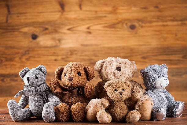 istock Cute teddy bears on wooden background 623293124