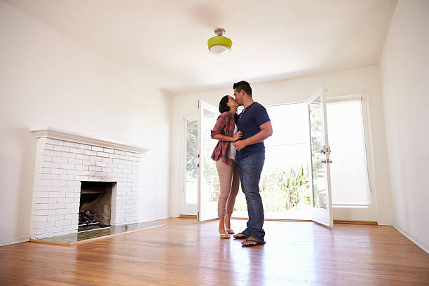 istock Romantic Couple In New Home On Moving Day 623294314