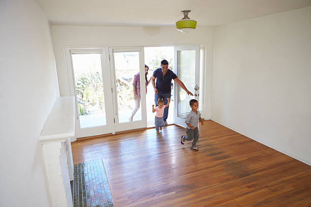 istock High Angle View Of  Family Exploring New Home On Moving 623294588