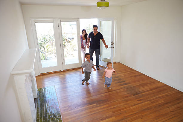 istock High Angle View Of  Family Exploring New Home On Moving 623294590
