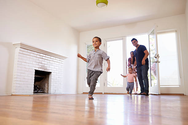 istock Excited Family Explore New Home On Moving Day 623294596