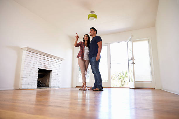 Excited Couple Explore New Home On Moving Day
