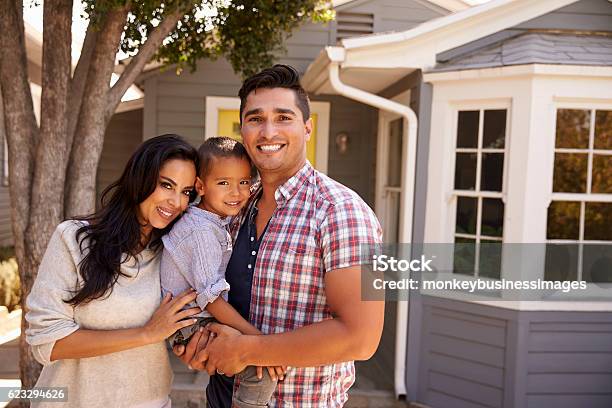 Portrait Of Family Standing Outside Home Stock Photo - Download Image Now - Family, Latin American and Hispanic Ethnicity, Home Ownership