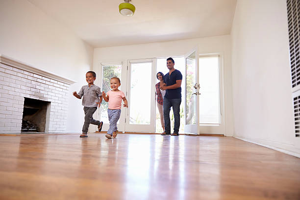 istock Excited Family Explore New Home On Moving Day 623294678