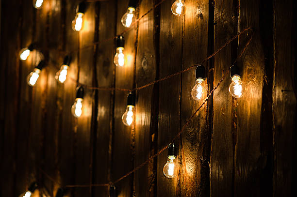 istock Designer light bulbs on dark wooden background 623297560