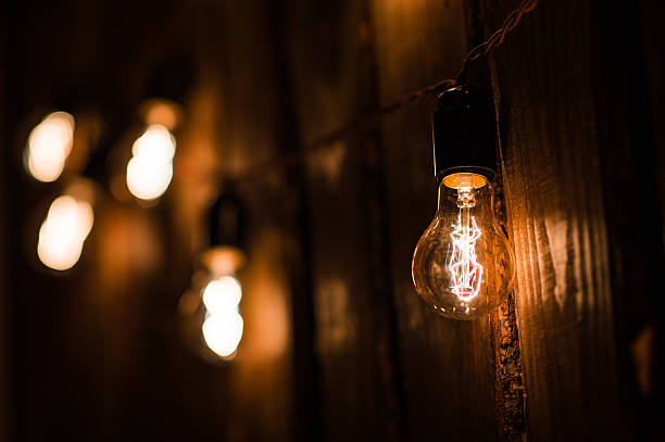istock Vintage incandescent Edison type bulbs on wooden wall 623297738