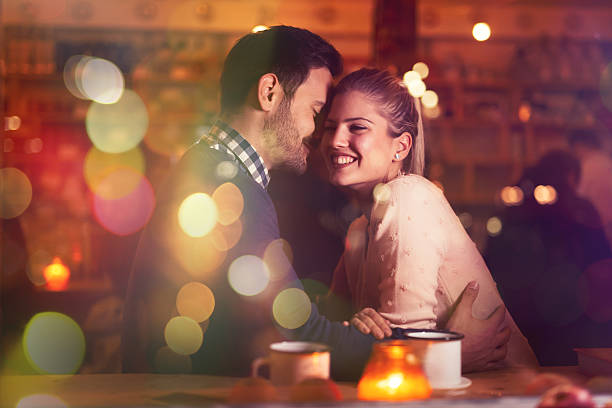 Romantic couple dating in pub Romantic couple dating in pub at night date night romance stock pictures, royalty-free photos & images