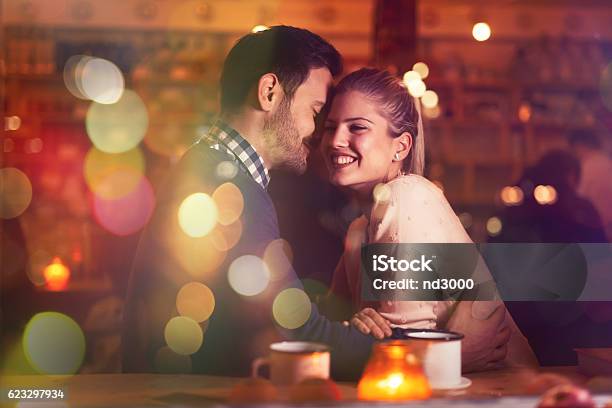 Romantic Couple Dating In Pub Stock Photo - Download Image Now - Flirting, Couple - Relationship, Women