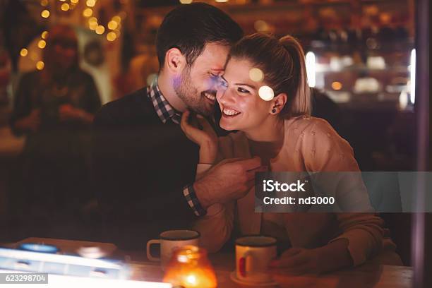 Couple Dating At Night In Pub Stock Photo - Download Image Now - Couple - Relationship, Boyfriend, Dating