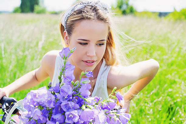 istock Beautiful young girl in summer field 623299776